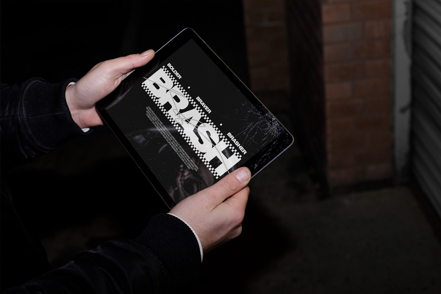 Person holding a tablet showcasing a grunge font style design, ideal for designers interested in fonts, graphics, tablet mockups.